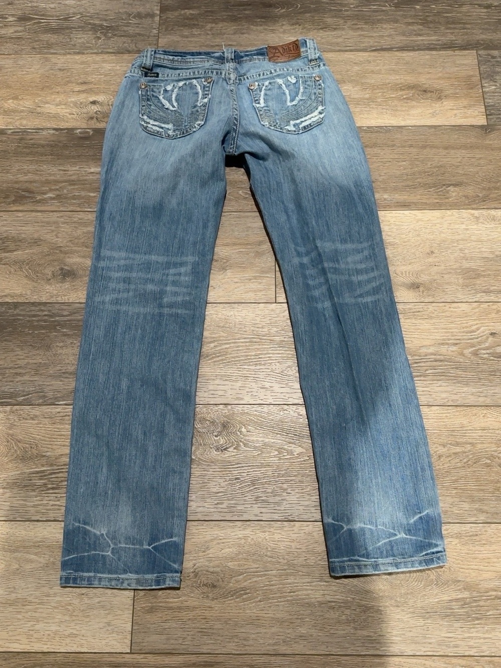 Women’s Straight Light Blue Distressed Jeans by (unknown)